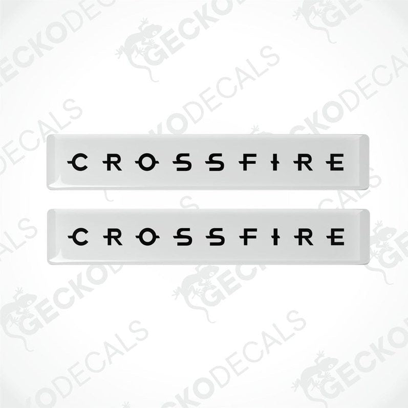 Two white vinyl stickers with the text 'CROSSFIRE' embossed in black.