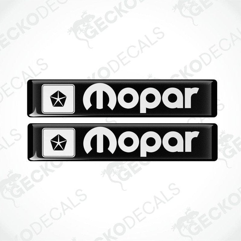 Two black rectangular polyurethane-coated vinyl stickers with a white background with the MOPAR logo and text