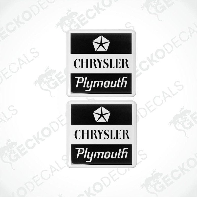 Two black and white vinyl decals with the text 'CHRYSLER' and 'Plymouth' on them, featuring a star logo.