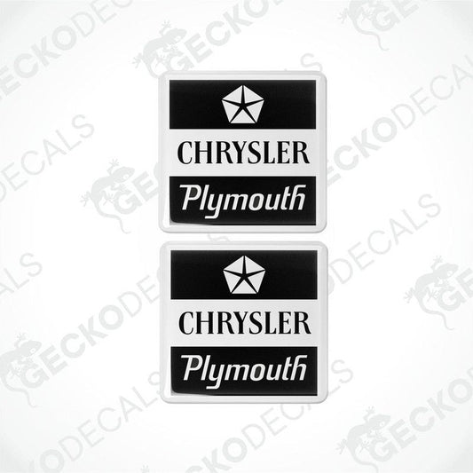 Two black and white vinyl decals with the text 'CHRYSLER' and 'Plymouth' on them, featuring a star logo.