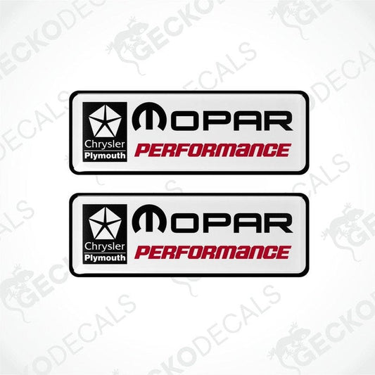 Two rectangular vinyl decals with a polyurethane coating, featuring the 'MOPAR Performance' logo in red and black on a white background, and the 'Chrysler Plymouth' branding.