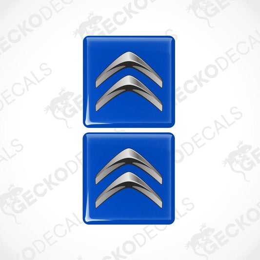 Two blue vinyl decals with a silver chevron design.