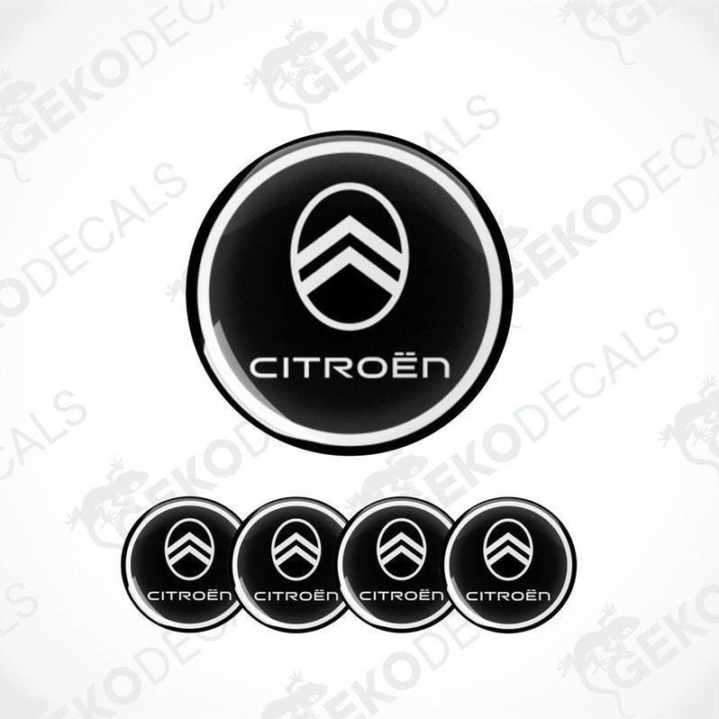 A set of four black and white vinyl stickers with the CITROEN brand logo.