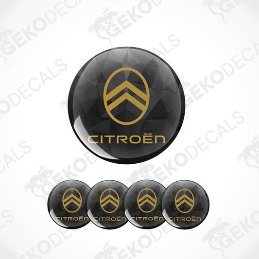 A set of four black vinyl stickers with gold CITROEN branding designed for car decals.