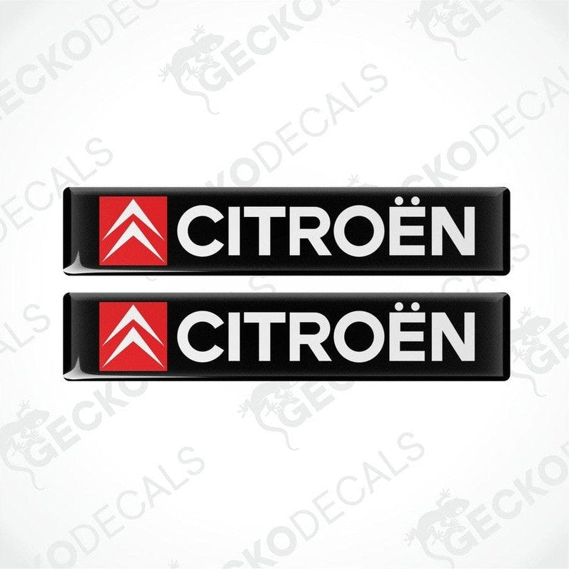 Two rectangular black, red, and white car decals with the CITROEN brand logo