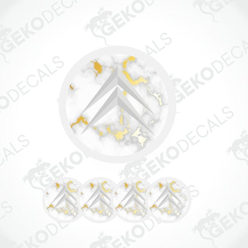 Four dome-shaped stickers with the Citroen logo in white and gold