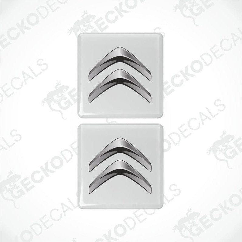 Two white vinyl decals with a silver chevron design.