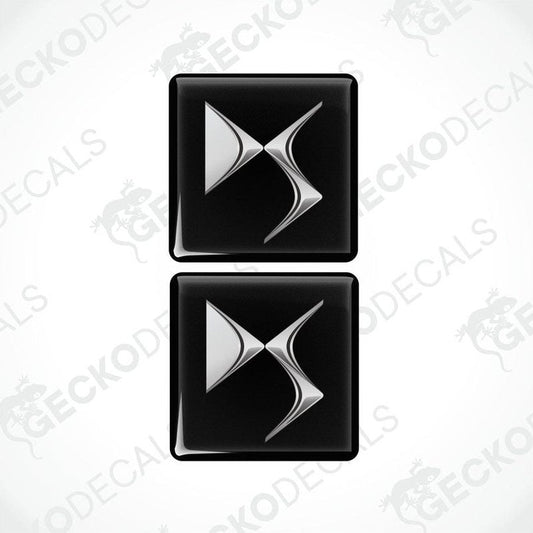 Two black and silver car decals with a geometric pattern design.