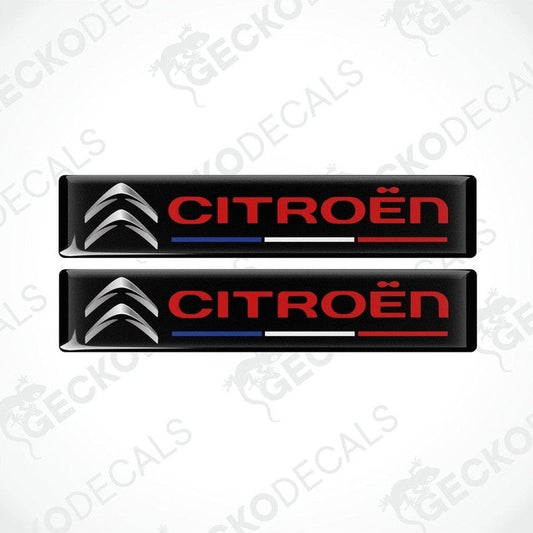 Two rectangular vinyl decals with a polyurethane coating featuring the CITROEN brand logo in red and silver on a black background. The decals have a glossy finish.