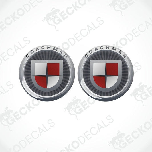 Two round vehicle decals with a shield design and the text 'COACHMAN' on them.