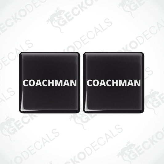 Two black vinyl stickers with the word 'COACHMAN' printed in white.