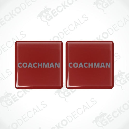 Two red vinyl stickers with the word 'COACHMAN' printed in bold letters, placed against a white background with a Gecko Decals watermark.