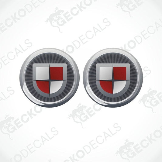 Two round vehicle decals with a shield design and the text 'COACHMAN' on them.