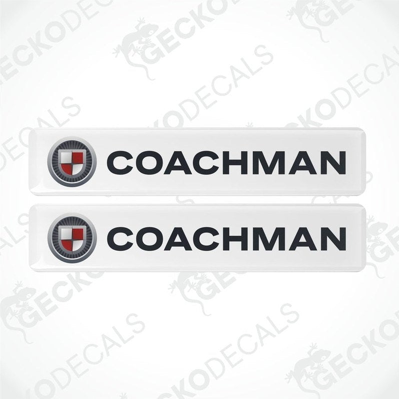 Two white vinyl stickers with the word 'COACHMAN' and a logo depicting a shield and a letter 'C' in the center, placed against a white background with a Gecko Decals watermark.