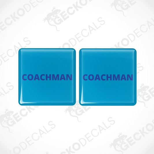 Two blue vinyl stickers with the word 'COACHMAN' 
