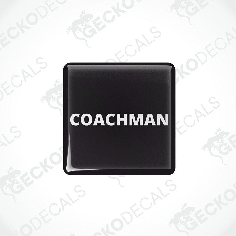 Two black vinyl stickers with the word 'COACHMAN' printed in white.