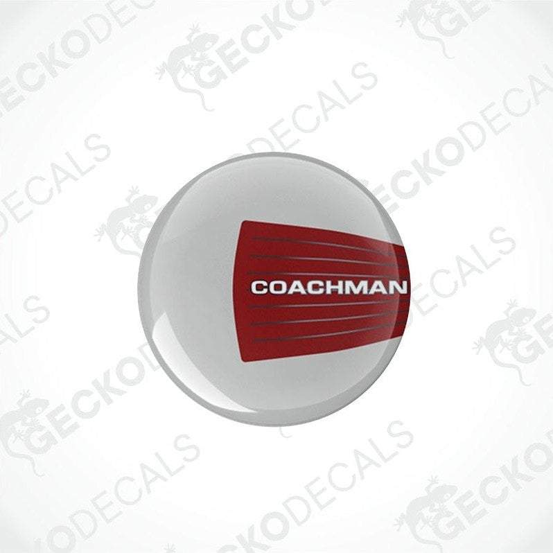 Two round white vinyl decals with the red text 'COACHMAN' on them, placed on a white background.