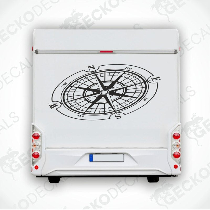A white vehicle decal featuring a black compass design.