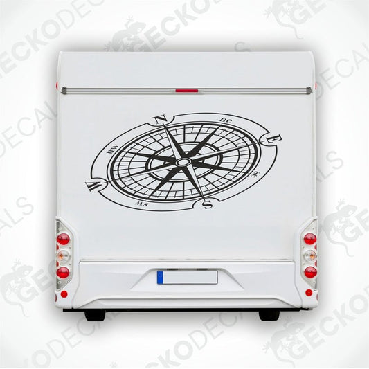 A white vehicle decal featuring a black compass design.