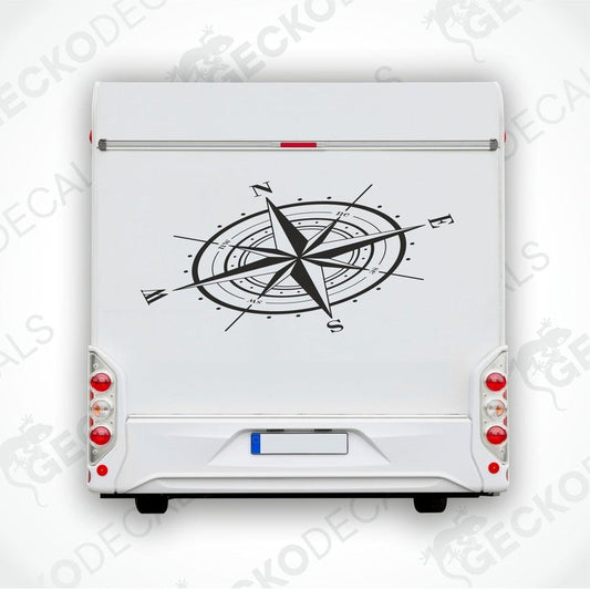 A white vehicle decal featuring a black compass design.
