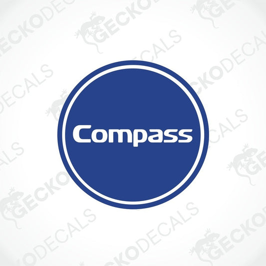A circular blue and white sticker with the word 'Compass' in the center, resembling a compass logo.
