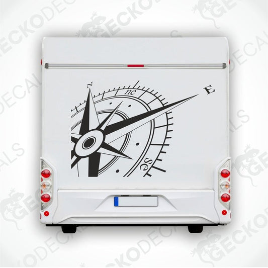 A white vehicle decal featuring a black and gray compass design.