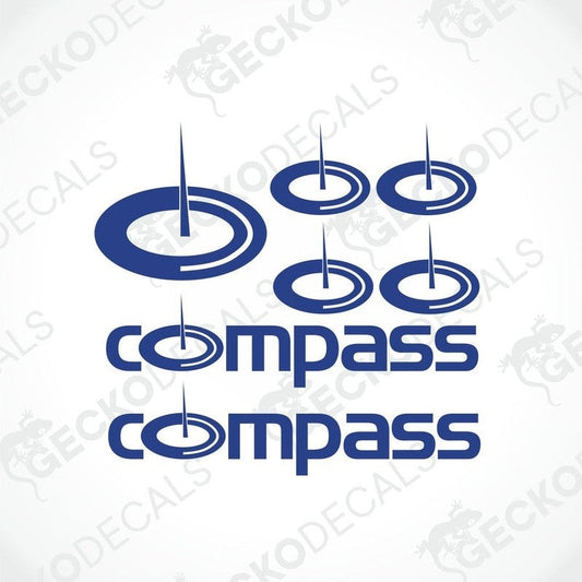 A set of blue compass-themed vehicle decals of varying sizes with the word 'COMPASS' prominently displayed.