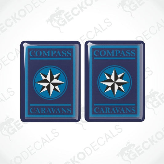 Two blue vinyl stickers with a white compass design and the word 'CAMPERVANS' printed on them.