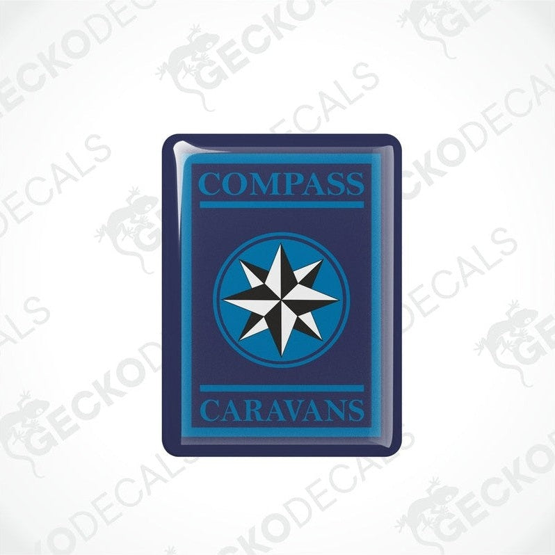 Two blue vinyl stickers with a white compass design and the word 'CAMPERVANS' printed on them.