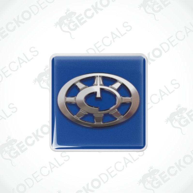 Two blue vinyl decals with a silver compass design, intended for use as stickers on vehicles.