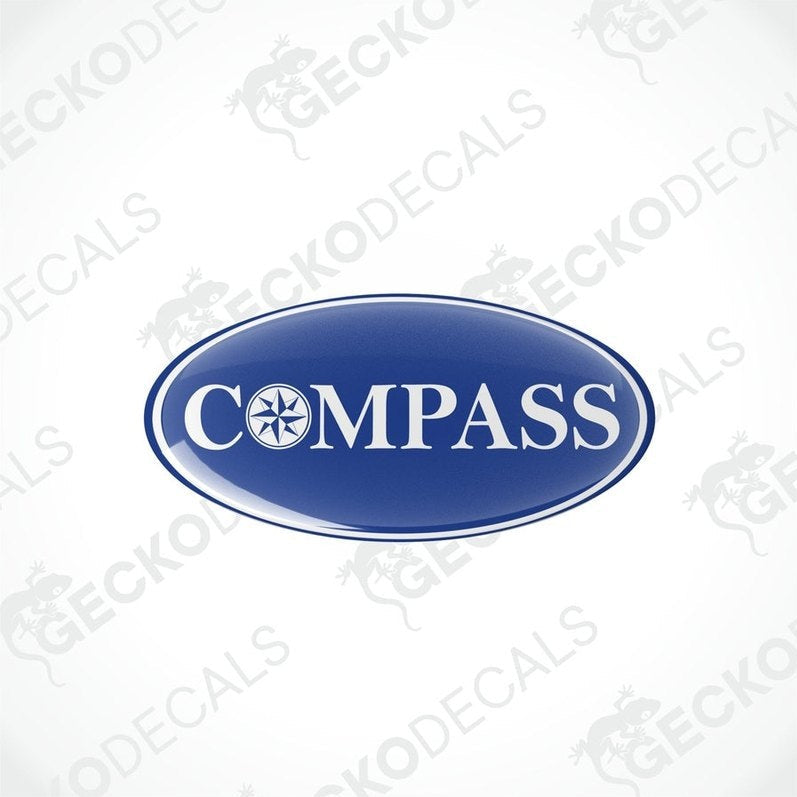 Two blue vinyl decals with the word 'COMPASS' written on them, placed against a white background.