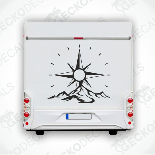 A die cut decal featuring a compass design with mountains, intended for use on a caravan.