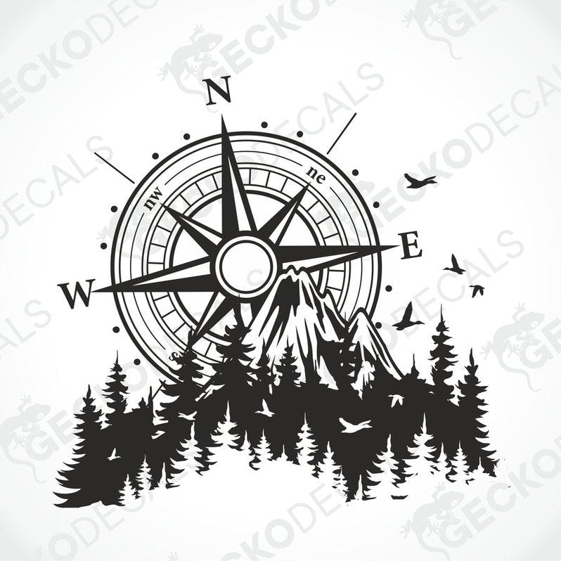 A black and white decal of a compass with mountains and trees on a vehicle.