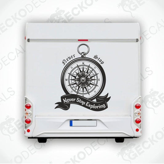 Black vintage compass decal on RV rear door with Never Stop Exploring text