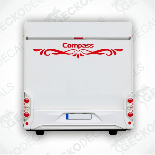 Rear decal of a white caravan with the brand name 'COMPASS' in red.