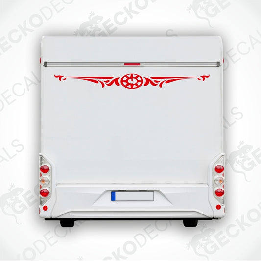 White caravan with a red and black compass design decal on the rear side.