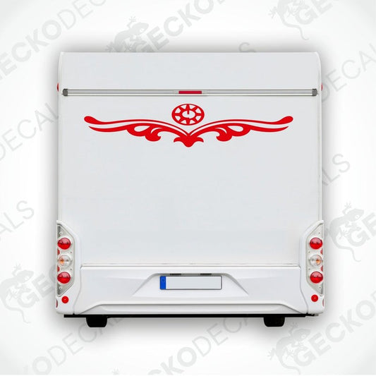 White caravan with a red and black compass design decal on the rear side.