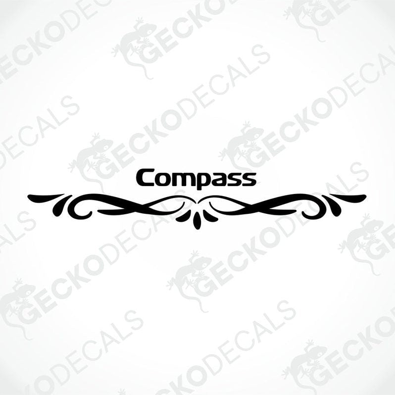 Rear decal of a white caravan with the brand name 'COMPASS' in red.
