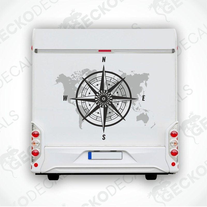 A white vehicle decal featuring a black compass with a world map background.