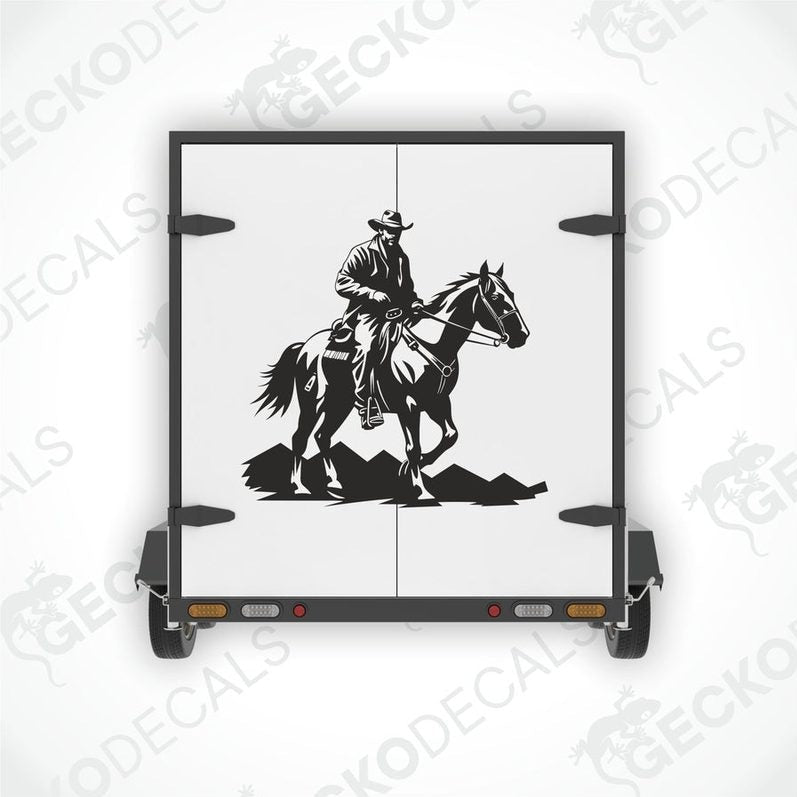 A die cut decal featuring a black and white cowboy riding a horse on the back of a trailer.
