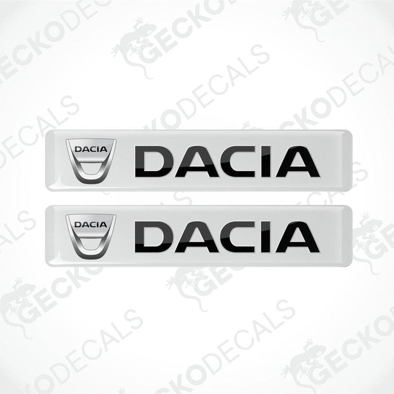 Two white vinyl stickers with the word 'DACIA' written in bold letters, placed against a white background.