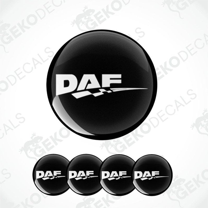 A set of four black vinyl stickers with the DAF logo printed on them, designed for use as wheel covers.