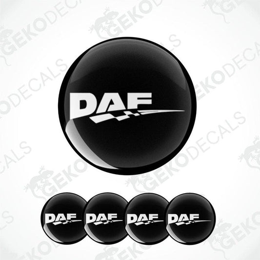 A set of four black vinyl stickers with the DAF logo printed on them, designed for use as wheel covers.