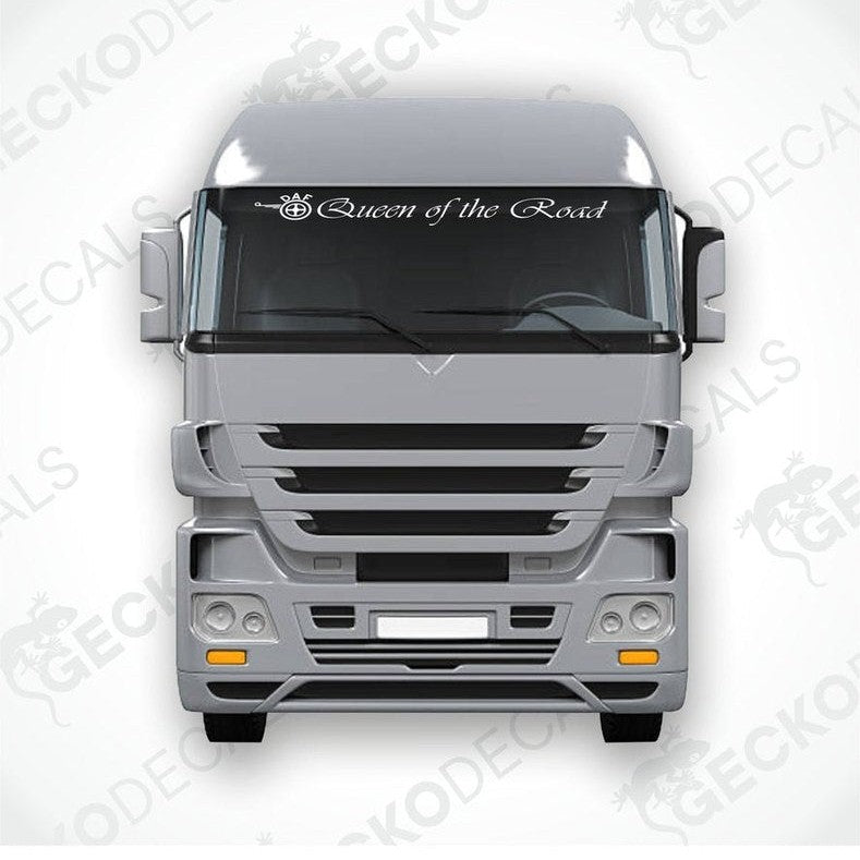 A die cut decal with the phrase 'Queen of the Road' positioned on the windshield of a gray truck.