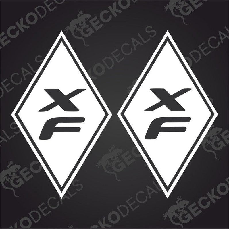 Two white diamond-shaped car decals with the letters 'XF' in the center, one with the decal face up and the other with the decal face down, both on a black background with a 'GeckoDecals' text overlay.