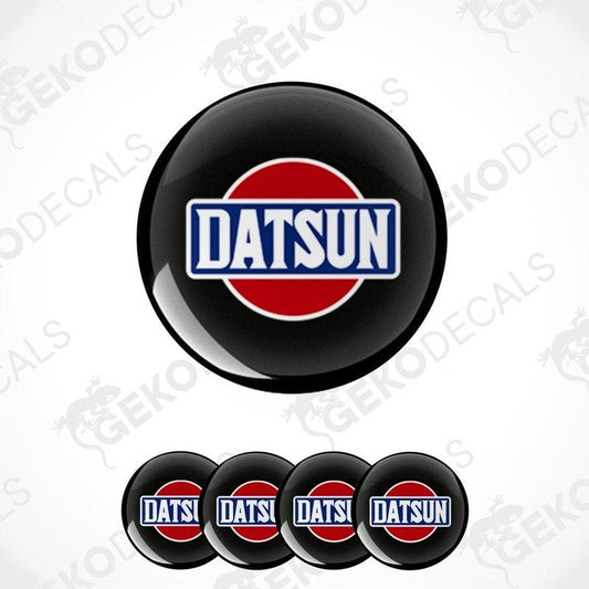 A set of four vinyl decals with polyurethane coating featuring the Datsun logo in black, red, and white colors.