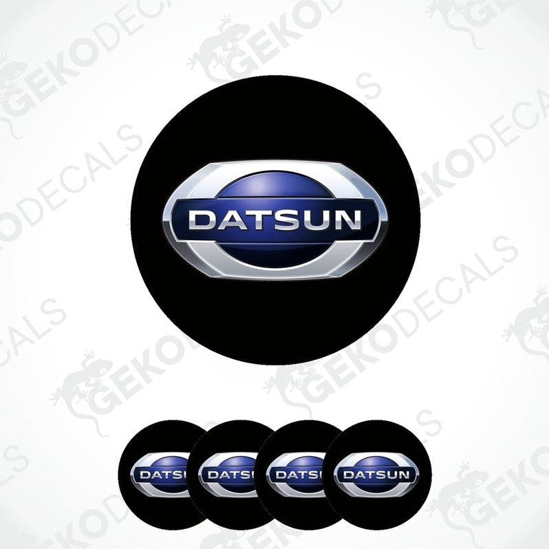 A set of four black vinyl decals with the Datsun logo in blue and white.