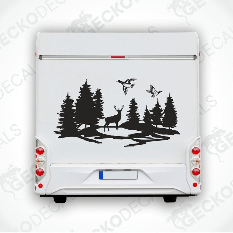 A die cut decal depicting a forest scene with trees, deer, and ducks, designed for use on vehicles or other surfaces.