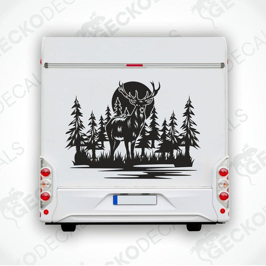 A die cut decal of a deer in a forest setting, intended for use on vehicles or other surfaces, displayed on a white background.