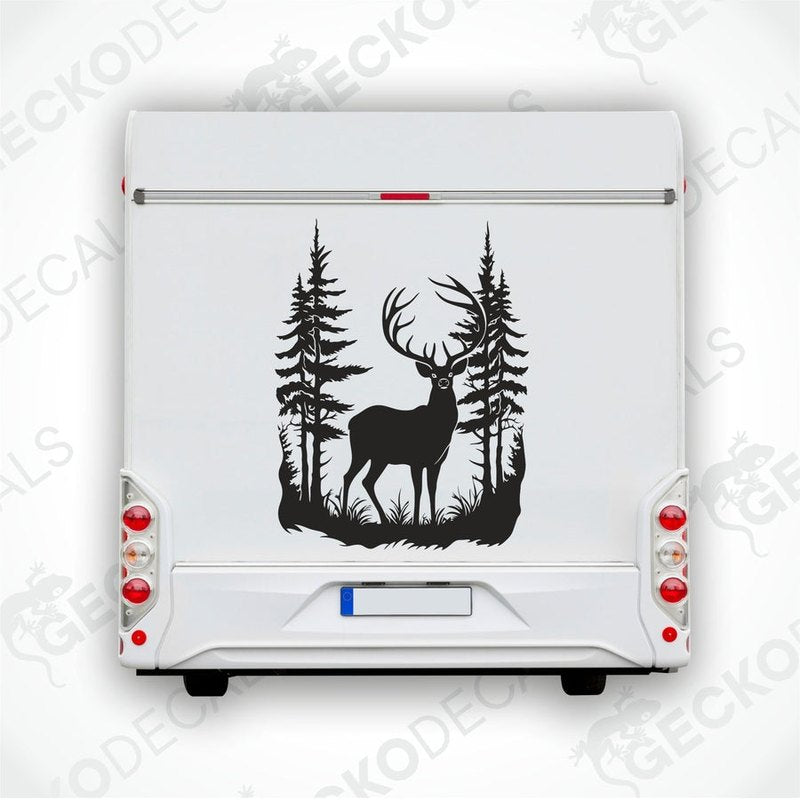 A decal of a black deer with antlers, placed on the side of a white vehicle, set against a background of a forest.